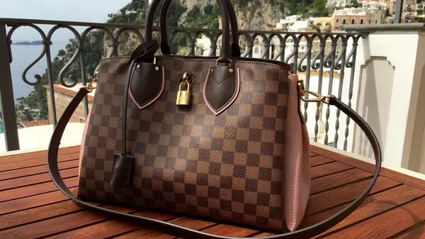 Louis Vuitton Designer bag on table