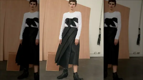 woman posing in structural dress