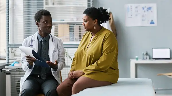 Woman speaks with doctor