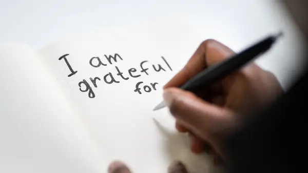 Person writing in a journal