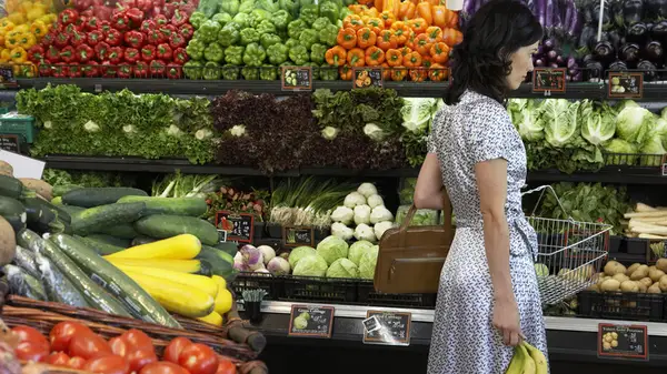 Woman shops for produce
