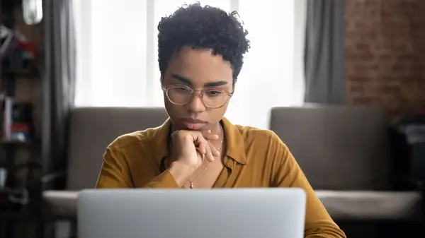 woman researching on laptop