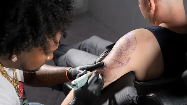 person getting a tattoo