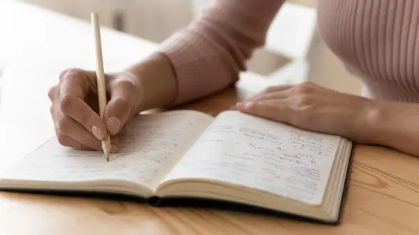 Woman writes in journal