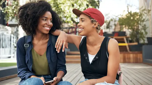 Queer couple smiling