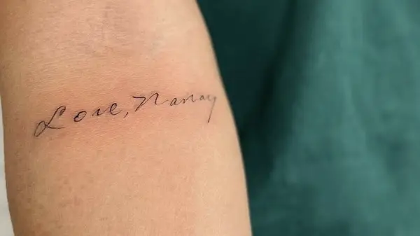 tattoo of hand-written script