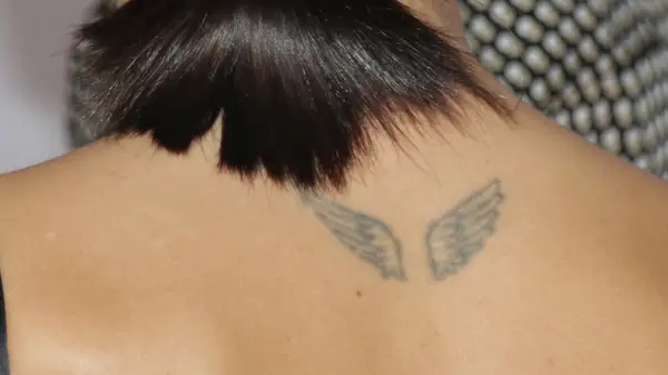Tattoo of angel wings on woman