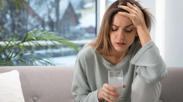 Woman nursing a hangover