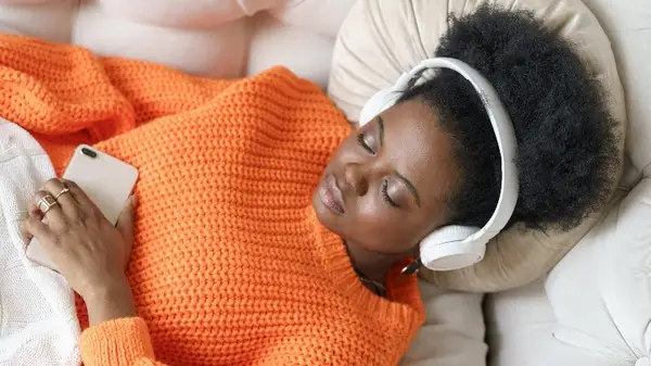Woman listening to headphones