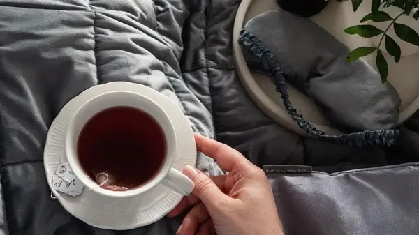 Mug next to a weighted eye mask