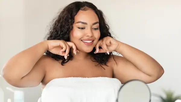 Woman touching both sides of jaw