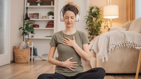 Woman meditating at home