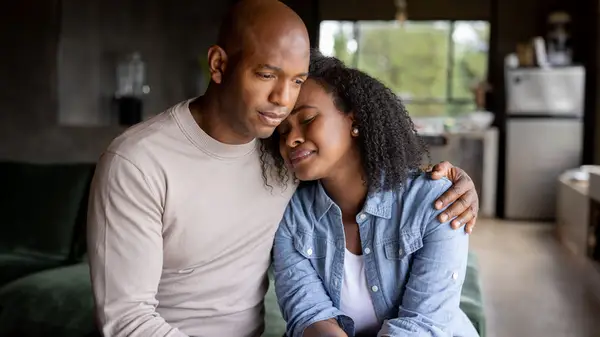Man consoling crying woman