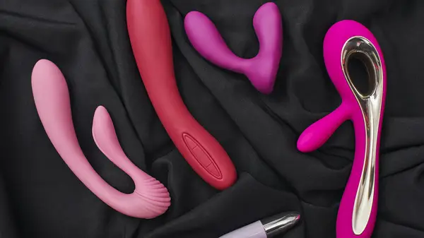 Holding sex toys