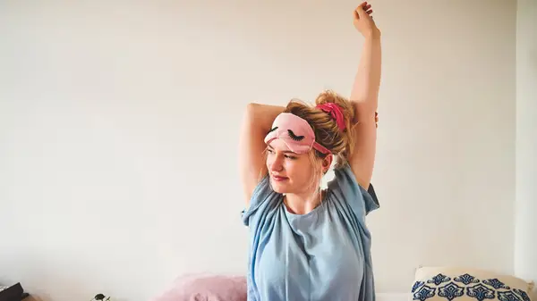 woman waking up in bed