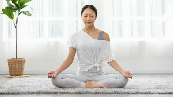 Woman meditating hands in mudra