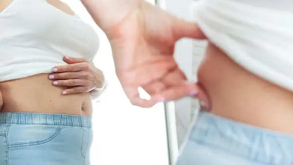 Woman examining her body 