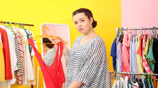 Disappointed woman clothes shopping