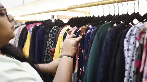 Woman browsing through clothes
