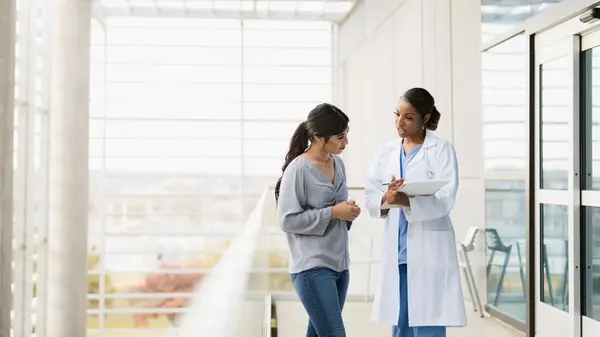 Woman speaking to a doctor