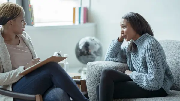 Woman speaking to a therapist