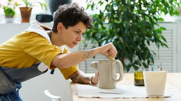 Person working on ceramics