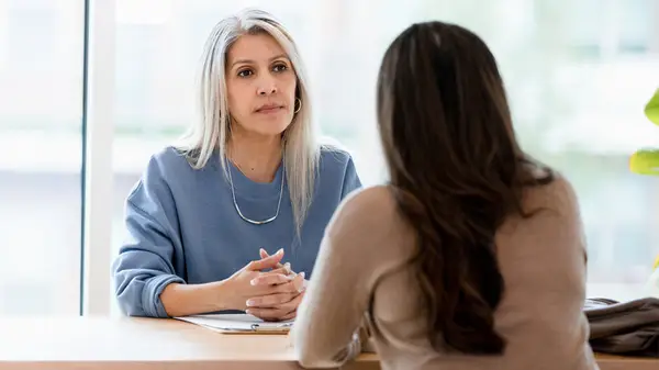 Woman speaking to her boss