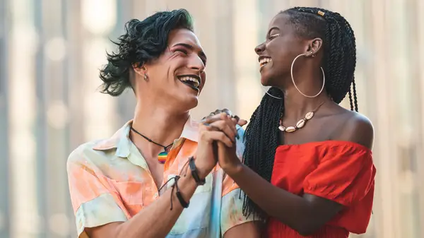 Two people holding hands