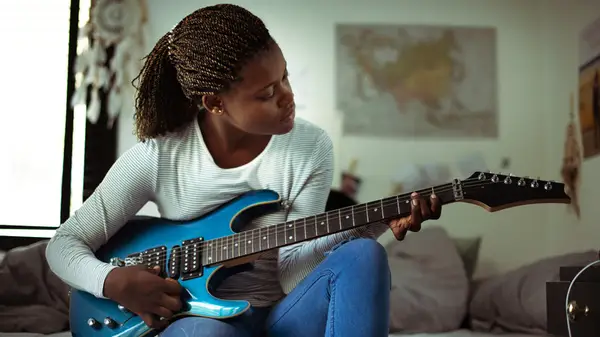 Woman playing guitar