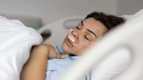Woman in hospital bed