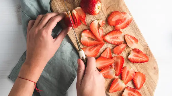 Cutting up strawberries