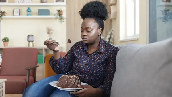 Woman eating cake