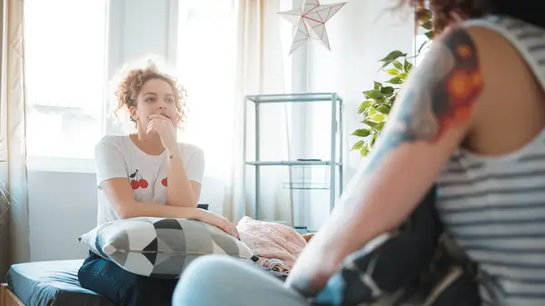 women having private conversation