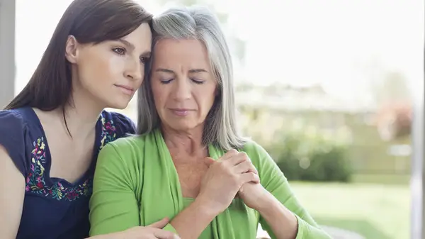 hugging mom and daughter