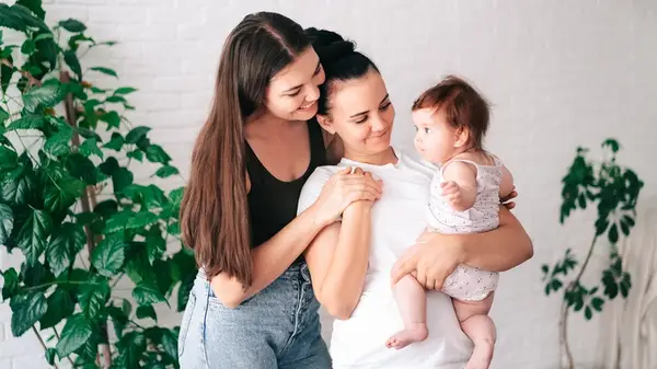 Couple looking at their baby