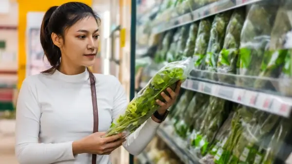 Woman buying greens