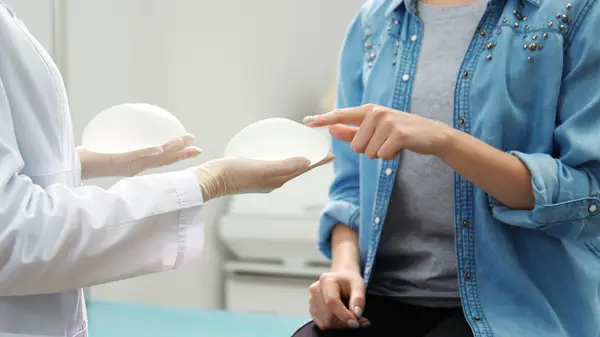 Holding breast implants