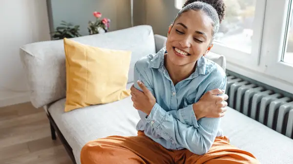 woman hugging herself