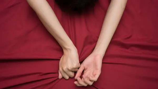 Hands grabbing sheets