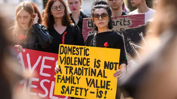woman protesting domestic abuse