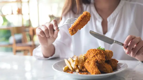 Eating fries and chicken