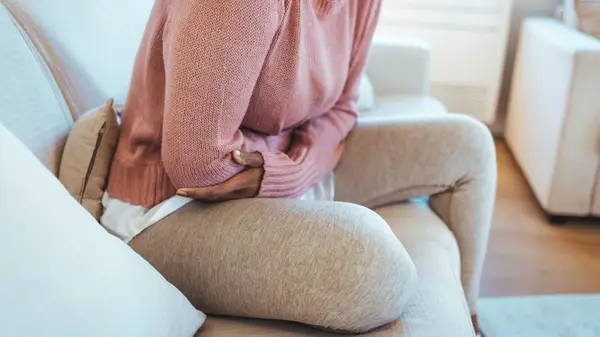 Person holding abdomen