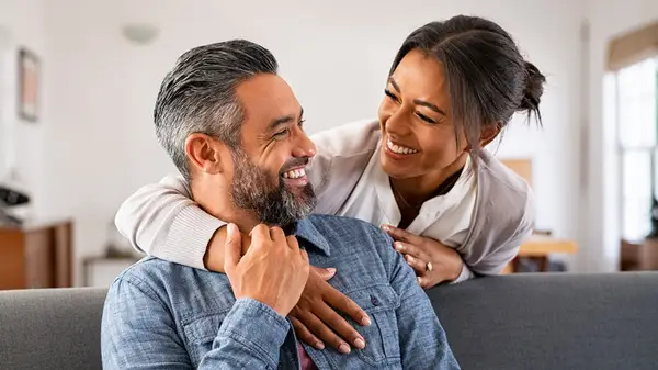 A couple smiling at each other