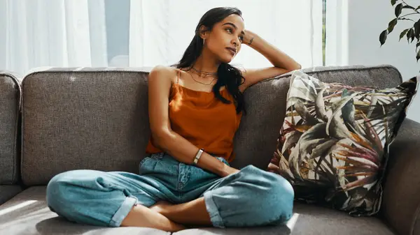 Woman sitting on a sofa