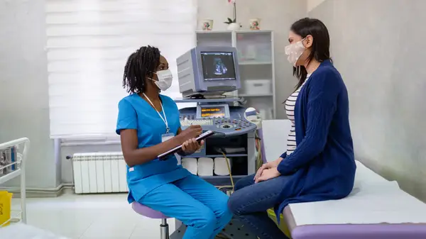 A woman consulting with her doctor