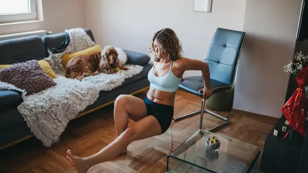 Woman works out at home