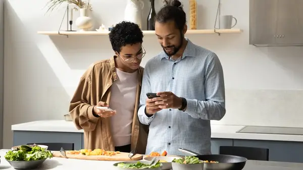 Two people cooking together