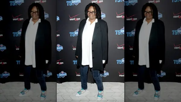 Whoopi Goldberg posing on the red carpet in 2010